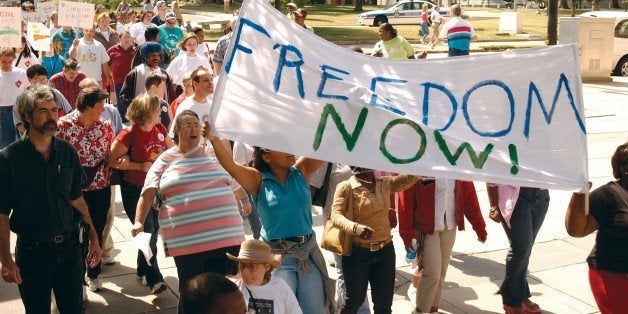 Large crowd of people with and without disabilites participating in a Freedom March to advocate for the civil rights of peopl