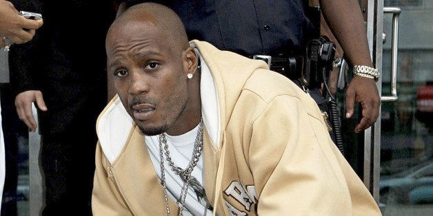 Rapper DMX, whose real name is Earl Simmons, poses as he leaves Queens criminal court Tuesday, Oct. 11, 2005, in New York. He attended a hearing in state Supreme Court on charges of reckless endangerment. (AP Photo/ Louis Lanzano)
