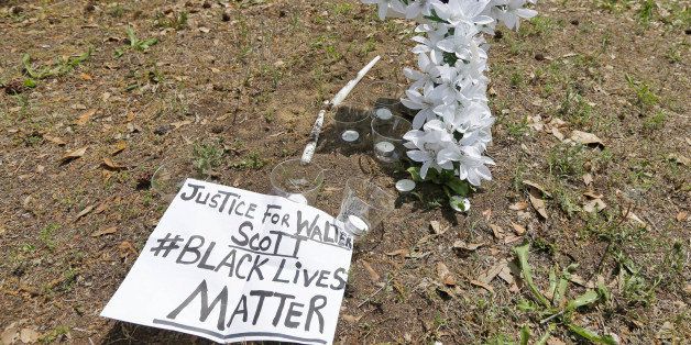 A memorial is placed near the site where Walter Scott was killed in North Charleston, S.C., Wednesday, April 8, 2015. Scott was killed by a North Charleston police officer after a traffic stop on Saturday. The officer, Michael Thomas Slager, has been charged with murder. (AP Photo/Chuck Burton)