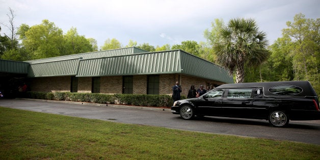 SUMMERVILLE, SC - APRIL 11: The hearse carrying Walter Scott arrives arrives at the W.O.R.D. Ministries Christian Center for his funeral, after he was fatally shot by a North Charleston police officer after fleeing a traffic stop in North Charleston on April 11, 2015 in Summerville, South Carolina. Mr. Scott was killed on April 4 by North Charleston police officer Michael T. Slager after a traffic stop. The officer now faces murder charges. (Photo by Joe Raedle/Getty Images)