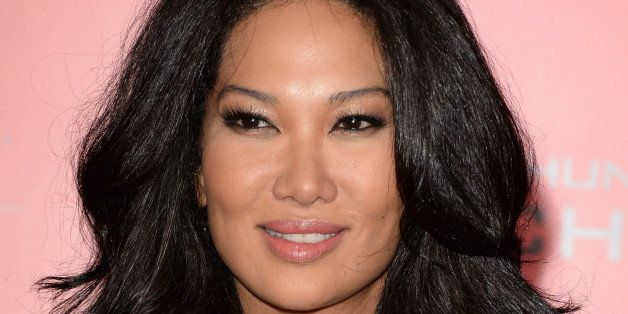 LOS ANGELES, CA - NOVEMBER 18: TV personality Kimora Lee Simmons arrives at the premiere of Lionsgate's 'The Hunger Games: Catching Fire' at Nokia Theatre L.A. Live on November 18, 2013 in Los Angeles, California. (Photo by Jason Merritt/Getty Images)