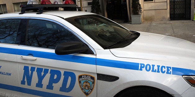 NEW YORK, NY - JANUARY 07: A police car sits parked outside of the French Consulate in Manhattan following terrorist attacks