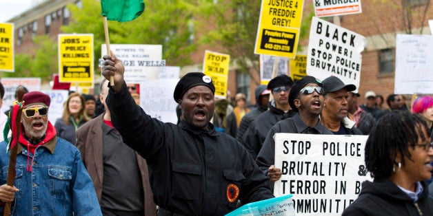 Demonstrators protest in the streets as they march for Freddie Gray to Baltimore's City Hall, Saturday, April 25, 2015. Gray died from spinal injuries about a week after he was arrested and transported in a police van. (AP Photo/Jose Luis Magana)