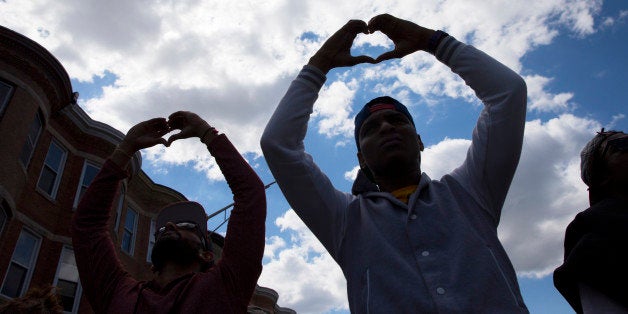 Demonstrators gather in the aftermath of rioting following Monday's funeral for Freddie Gray, who died in police custody, on