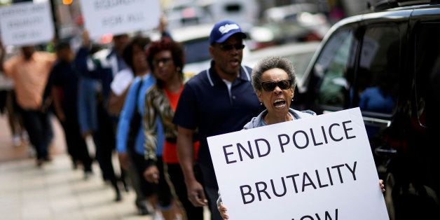 Protestors demonstrate outside the State Attorney's office calling for the continued investigation into the death of Freddie Gray, Wednesday, April 29, 2015, in Baltimore. Activists stressed that they will continue to press for answers in the case of Gray, the 25-year-old black man whose death from a spinal-cord injury under mysterious circumstances while in police custody set off the riots. (AP Photo/David Goldman)