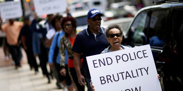 Protestors demonstrate outside the State Attorney's office calling for the continued investigation into the death of Freddie