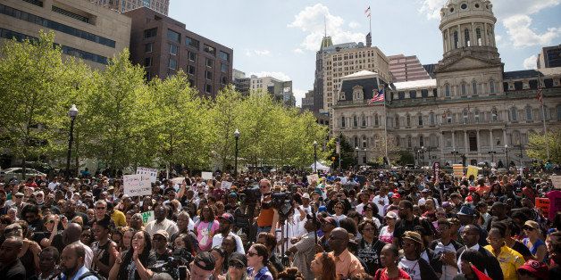 BALTIMORE, MD - MAY 03: People attend a rally lead by faith leaders in front of city hall calling for justice in response to the death of Freddie Gray on May 3, 2015 in Baltimore, Maryland. Gray later died in custody; the Maryland state attorney announced on Friday that charges would be brought against the six police officers who arrested Gray. (Photo by Andrew Burton/Getty Images)