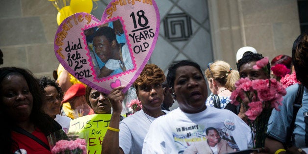 WASHINGTON, DC - MARCH 9: People join mothers from around the country, who lost their children to police brutality, and protest in front of the Justice Department at the Million Mom March on May 9, 2015 in Washington, D.C. The march, organized by Mothers for Justice, was a call to action in the wake of recent murders by police officers around the country. (Photo by Gabriella Demczuk/Getty Images)