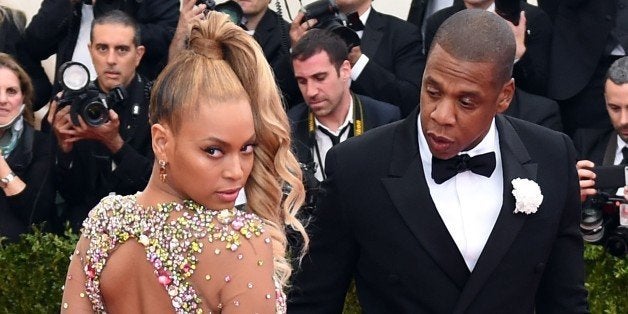 Beyonce and Jay Z arrive at the 2015 Metropolitan Museum of Art's Costume Institute Gala benefit in honor of the museums latest exhibit China: Through the Looking Glass May 4, 2015 in New York. AFP PHOTO / TIMOTHY A. CLARY (Photo credit should read TIMOTHY A. CLARY/AFP/Getty Images)