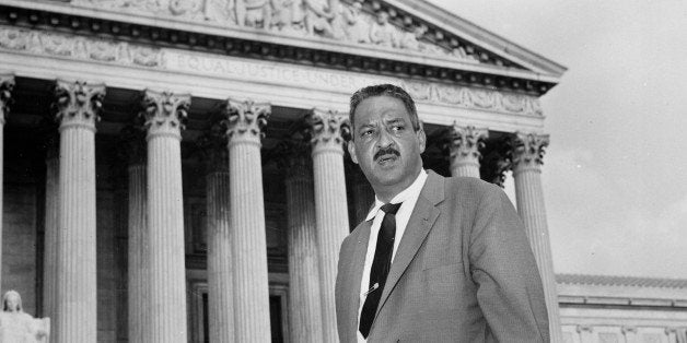 FILE - This Aug. 22, 1958 file photo shows Thurgood Marshall outside the Supreme Court in Washington. Saturday marks the 60th anniversary of the landmark Brown v. Board of Education decision. Many inequities in education still exist for black students and for Hispanics, a population that has grown exponentially since the 1954 ruling. Marshall, the head of the NAACP's legal arm who argued part of the case, went on to become the Supreme Court's first African-American justice in 1967. (AP Photo, File)