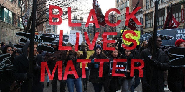 NEW YORK, NY - DECEMBER 13: Thousands of protestors converge on Manhattan's Washington Square Park to march through the Manhattan to protest the police violence on December 13, 2014 in New York, United States. Protestors shout slogans as Hands up, dont shoot, Black lives matter and I cant breathe during the march. (Photo by Mustafa Caglayan/Anadolu Agency/Getty Images)