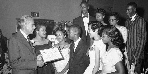 New York Gov. W. Averell Harriman passes out awards to nine black students who were the first to attend Central High School in Little Rock, Ark., June 12, 1958. With the governor at the Hotel and Club Employees Union in New York are Minnijean Brown, Gloria Ray, Ernest Green, Carlotta Walls and Melba Patillo. At rear, from left,Terrance Roberts, Elisabeth Eckford, Thelma Mothershed and Jefferson Thomas. The students were honored by Local 6 of the union for having done the most to advance the cause of equal rights for all Americans. (AP Photo/Hans von Nolde)