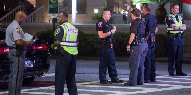 CHARLESTON, SC - JUNE 17: Police close off Calhoun Street where a gunman opened fire on a prayer meeting killing nine people at historic Mother Emanuel African Methodist Episcopal Church on June 17, 2015 in Charleston, South Carolina. Police believe the attack is a hate crime and are searching for a young white man believed to be the only shooter. (Photo by Richard Ellis/Getty Images)