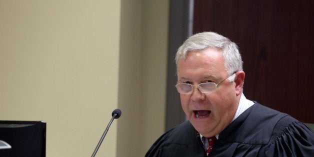 NORTH CHARLESTON, SC - JUNE 19: Judge James Gosnell speaks as Dylann Roof appears via video uplink from the detention center to the courtroom at Centralized Bond Hearing Court June 19, 2015 in North Charleston, South Carolina. Roof is charged with nine counts of murder and firearms charges in the shooting deaths at Emanuel African Methodist Episcopal Church in Charleston, South Carolina on June 17. (Photo by Grace Beahm-Pool/Getty Images)