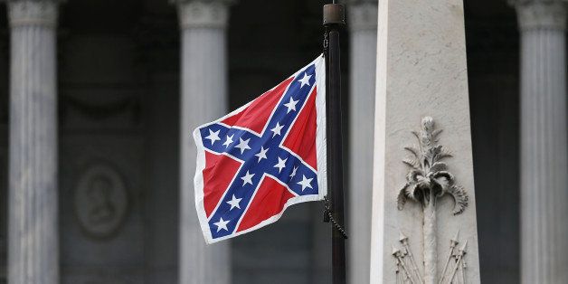 COLUMBIA, SC - JUNE 22: The Confederate flag flies on the Capitol grounds after South Carolina Gov. Nikki Haley announced that she will call for the Confederate flag to be removed on June 22, 2015 in Columbia, South Carolina. Debate over the flag flying at the Capitol was again ignited off after nine people were shot and killed during a prayer meeting at the Emanuel African Methodist Episcopal Church in Charleston, South Carolina. (Photo by Joe Raedle/Getty Images)