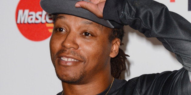 Lupe Fiasco arrives at the 4th Annual Stand Up 2 Cancer Live Benefit at The Dolby Theatre on Friday, Sept. 5, 2014, in Los Angeles. (Photo by Jordan Strauss/Invision/AP)