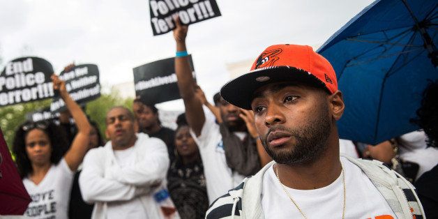 BALTIMORE, MD - APRIL 30: Activists protest in front of City Hall after marching from the Sandtown neighborhood to demand better police accountability and racial equality following the death of Freddie Gray on April 30, 2015 in Baltimore, Maryland. Gray, 25, was arrested for possessing a switch blade knife April 12 outside the Gilmor Houses housing project on Baltimore's west side. According to his attorney, Gray died a week later in the hospital from a severe spinal cord injury he received while in police custody. (Photo by Andrew Burton/Getty Images)