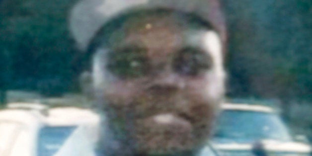 FILE - In this undated photo provided by the Brown family is Michael Brown, the black 18-year-old who was fatally shot by a w