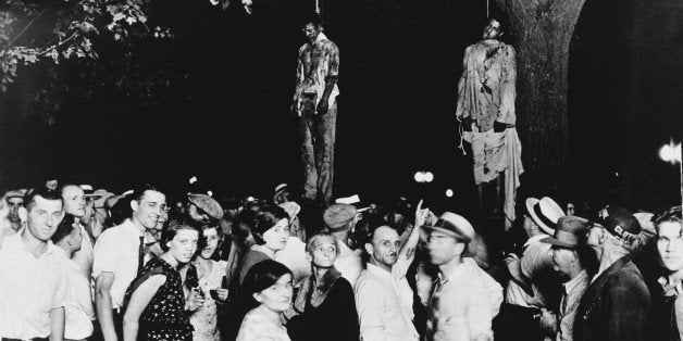 A crowd gathering to witness the killing of Thomas Shipp and Abram Smith, two victims of lynch law in Marion, Indiana, 7th Au