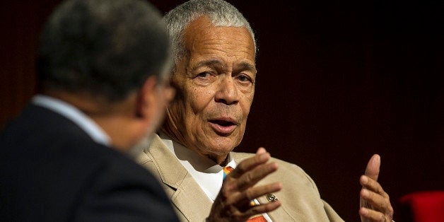 AUSTIN, TX - APRIL 9: Julian Bond, former Chairman, NAACP (R) looks over towards Lonnie G. Bunch, III, moderator, during the