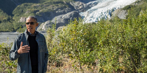 President Barack Obama speaks to members of the media while on a hike to the Exit Glacier in Seward, Alaska, Tuesday, Sept. 1, 2015, which according to National Park Service research, has retreated approximately 1.25 miles over the past 200 years. Obama is on a historic three-day trip to Alaska aimed at showing solidarity with a state often overlooked by Washington, while using its glorious but changing landscape as an urgent call to action on climate change. (AP Photo/Andrew Harnik)