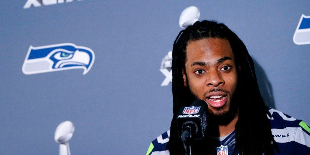 Seattle Seahawks' Richard Sherman answers a question at a news conference for NFL Super Bowl XLIX football game, Wednesday, J