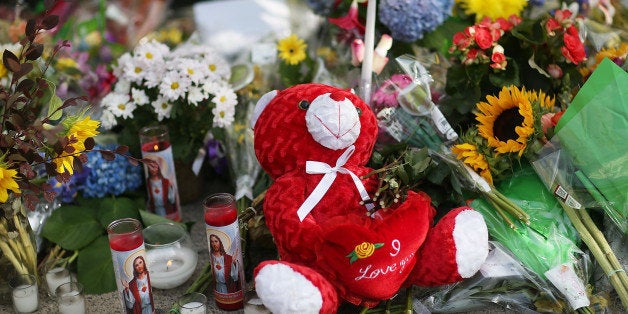 CHARLESTON, SC - JUNE 19: A teddy bear is seen in the memorial setup in front of Emanuel African Methodist Episcopal Church after a mass shooting at the church that killed nine people of June 19, 2015. A 21-year-old white gunman is suspected of killing nine people during a prayer meeting in the church, which is one of the nation's oldest black churches in Charleston. (Photo by Joe Raedle/Getty Images)