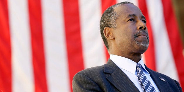 Republican presidential candidate Dr. Ben Carson looks on as he is introduced to speak at a town hall meeting, Friday, Oct. 2