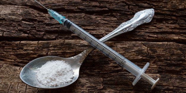 heroin in a spoon and a syringe