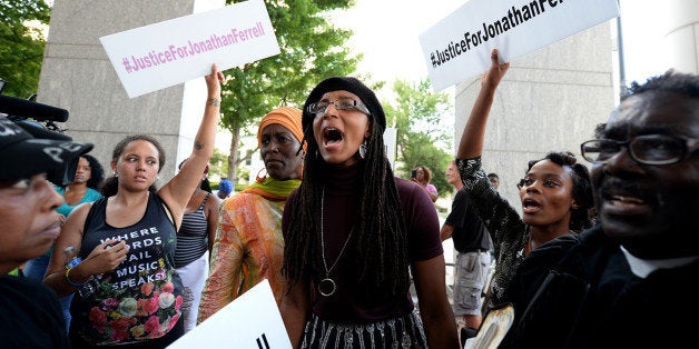 A young woman yells, 'black lives matter,' with other protesters at the Mecklenburg County Courthouse on Friday, August 21, 2015 protesting when after four days of deliberations, a mistrial was declared when the jury was unable to resolve a deadlock in the case of Randall 'Wes' Kerrick in Charlotte, N.C. Kerrick, a Charlotte-Mecklenburg Police officer accused of killing an unarmed man, Jonathan Ferrell, in a struggle two years ago. (Jeff Siner/Charlotte Observer/TNS via Getty Images)