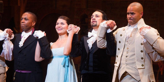 Leslie Odom Jr., from left, Phillipa Soo, Lin-Manuel Miranda and Christopher Jackson appear at the curtain call following the opening night performance of "Hamilton" at the Richard Rodgers Theatre on Thursday, Aug. 6, 2015, in New York. (Photo by Charles Sykes/Invision/AP)