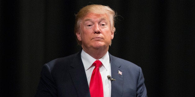 NEWTON, IA - NOVEMBER 19: Republican presidential candidate Donald Trump speaks to guests following a town hall meeting at Des Moines Area Community College Newton Campus on November 19, 2015 in Newton, Iowa. Trump is currently leading the race for the Republican presidential nomination in Iowa. (Photo by Scott Olson/Getty Images)