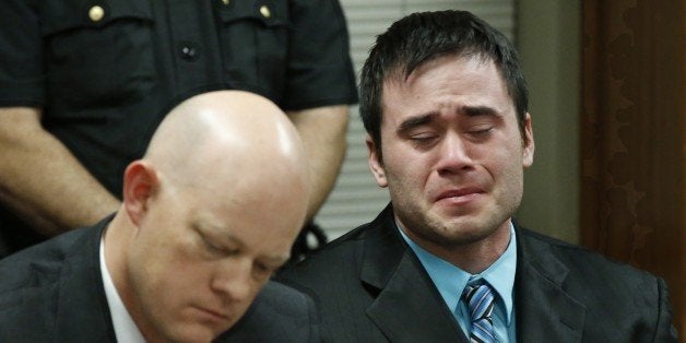 Daniel Holtzclaw, right, cries as the verdicts are read in his trial in Oklahoma City, Thursday, Dec. 10, 2015. At left is defense attorney Robert Gray. Holtzclaw, a former Oklahoma City police officer, was facing dozens of charges alleging he sexually assaulted 13 women while on duty. Holtzclaw was found guilty on a number of counts. (AP Photo/Sue Ogrocki, Pool)