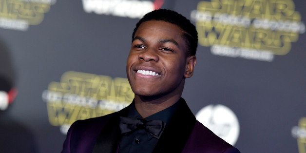 John Boyega arrives at the world premiere of "Star Wars: The Force Awakens" at the TCL Chinese Theatre on Monday, Dec. 14, 2015, in Los Angeles. (Photo by Jordan Strauss/Invision/AP)