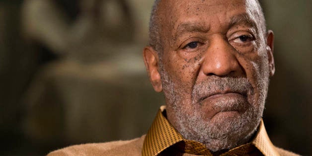 FILE - In this Nov. 6, 2014 file photo, entertainer Bill Cosby pauses during an interview in Washington about an upcoming exh