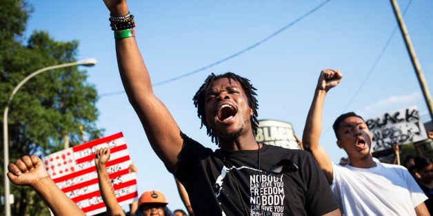 TORONTO, ON- JULY 27 - Uranranebi Agbeyegbe chants with the crowd during a Black Lives Matter protest that marched from Gilbe