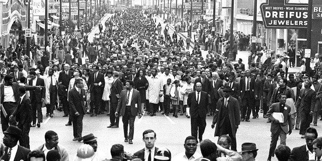 American civil rights campaigner, and widow of Dr. Martin Luther King Jr., Coretta Scott King (1927 - 2006) (center left, in black) and civil rights leader Reverend Ralph Abernathy (1926 - 1990) (center, right) lead a massive march following the assassination of husband only days earlier, Memphis, Tennessee, April 8, 1968. among others visible are Reverend Jesse Jackson (at left, in blazer and turtleneck), singer Harry Belafonte and his wife Julie, King's daughter Yolanda (1955 - 2007) (in white coat next to Belafonte), and politician Andrew Young (talking to man with the white beard and directly behind the bald man in the center fore). (Photo by Robert Abbott Sengstacke/Getty Images)