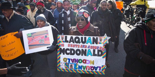 CHICAGO, IL - DECEMBER 31: Demonstrators calling for an end to gun violence and the resignation of Chicago Mayor Rahm Emanuel march through downtown on December 31, 2015 in Chicago, Illinois. The shooting deaths by police of a 19-year-old college student Quintonio LeGrier and his 55-year-old neighbor Bettie Jones and a recently released video showing the shooting of 17-year-old Laquan McDonald by Chicago Police officer Jason Van Dyke have sparked dozens of protests in the city. Yesterday Emanuel announced several changes that would take place in the police department with the hope of preventing future incidents. (Photo by Scott Olson/Getty Images)