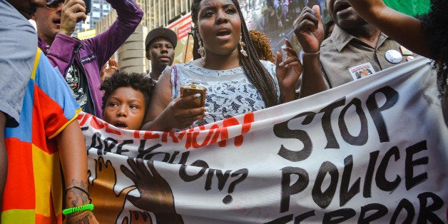 TIMES SQUARE, NEW YORK, UNITED STATES - 2015/08/13: After rallying near the NYPD station in Times Square at the conclusion of the march, demonstrators join with Wondaland in singing the group's protest song, 'Hell You Talmbout.' Members of the Stop Mass Incarceration Network held a rally in Times Square with Wondaland performers, including recording artists Jidenna and Janelle Monae, who performed their new protest song 'Hell You Talmbout.'. (Photo by Albin Lohr-Jones/Pacific Press/LightRocket via Getty Images)