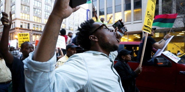 Protesters against police violence march towards the White House in Washington, April 29, 2015. The marchers joined the cause