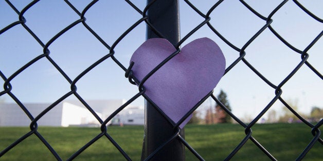 CHANHASSEN, MN - APRIL 22: A puple heart left by a fan is tucked into the fence which surrounds Paisley Park, the home and s