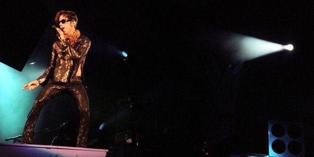 CA.PRINCE.1.1011.GF THE ARTIST FORMERLY KNOWN AS PRINCE, IN CONCERT SATURDAY EVENING, 10/11/97 AT THE HOLLYOOD BOWL. HE'S STANDING ON A PIANO IN THE OPENING SONGÂÂLAT/^^^Photo/Art by:^^^ (Photo by Gary Friedman/Los Angeles Times via Getty Images)