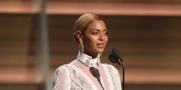 Beyonce presents the award for record of the year at the 58th annual Grammy Awards on Monday, Feb. 15, 2016, in Los Angeles. (Photo by Matt Sayles/Invision/AP)