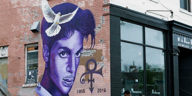 A mural honoring the late rock star Prince adorns a building in the Uptown area of Minneapolis Thursday, April 28, 2016, Prince died last week at his Paisley Park home at the age of 57. An investigation into his death continues. (AP Photo/Jim Mone)