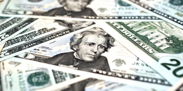 Macro shot of a pile of US$20 bills, showing the face of President Andrew Jackson