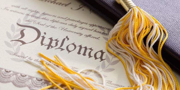 Close-up view of graduation tassel and diploma