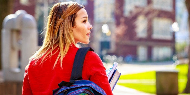 A young female college student between classes.