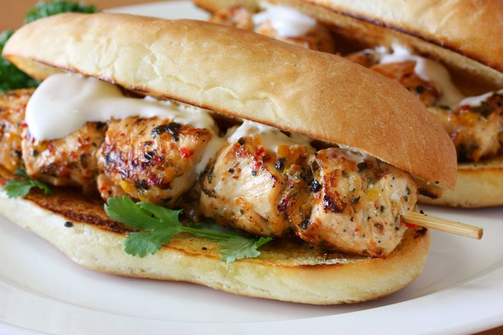 This is a chicken spiedie, featuring cubes of meat that have been marinated in an Italian dressing-like marinade. This version features melted cheese, but most versions are served without it.