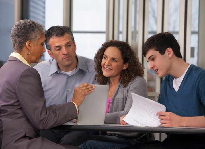 Parents and son talking with financial advisor