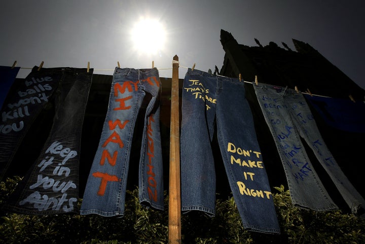 LOS ANGELES - APRIL 21: Blue jeans with messages challenging misconceptions about sexual violence are hung by the UCLA Clothesline Project on the University of California Los Angeles campus during Denim Day April 21, 2004 in Los Angeles, California. The UCLA Clothesline Project is a student organization which works to stop gender-based violence. In 1999, wearing jeans on Denim Day during Sexual Assault Awareness Month became an international symbol of protest against rape in response to an Italian Supreme Court decision, which overturned a rape conviction because the victim wore jeans. The Italian Court justices reasoned that the victim must have helped her attacker remove her jeans because they believed that without the victim's help, removing the jeans would be impossible. (Photo by David McNew/Getty Images)